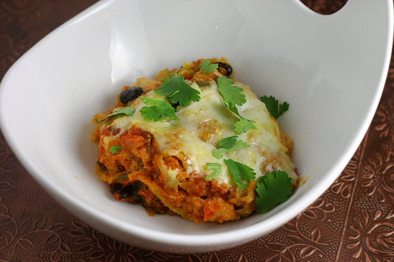 Enchilada Bake Veggie chicken enchilada bake topped with melted cheese