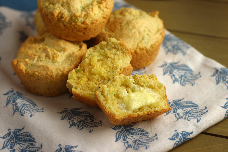 Cornbread Muffins Golden jalapeño cornbread muffins on a blue and white napkin